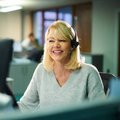 a female call center worker takes a call.